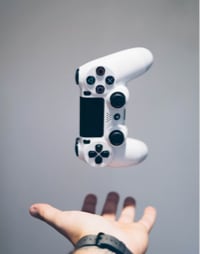 A hand catching a joypad